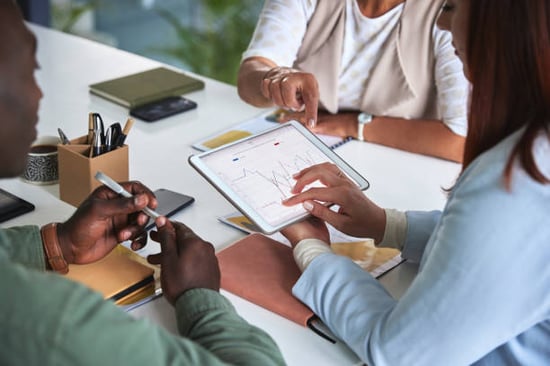 A group of people assess profits