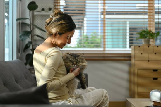 woman with cat in attractive business lobby