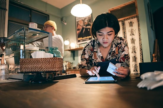 cat cafe owners working on tax deductions