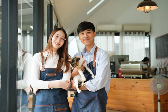 small pet business owners posing for portrait 