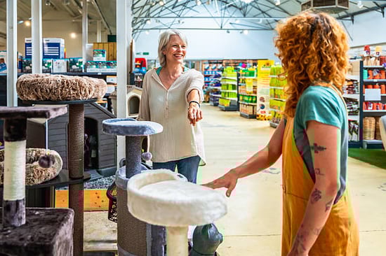 cattery owner picking out new supplies for her pet-care business