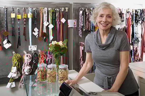 woman standing with pet retail products in a pet business