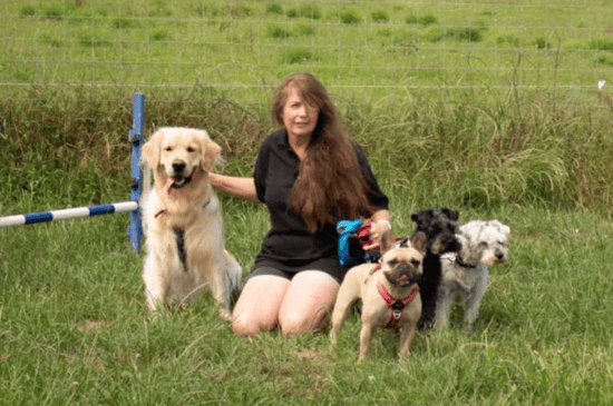 Nicky Davis and dogs outside at Classic Kennels